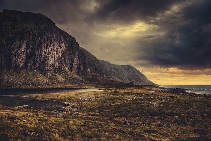 Mountain valley beneath a dramatic sky