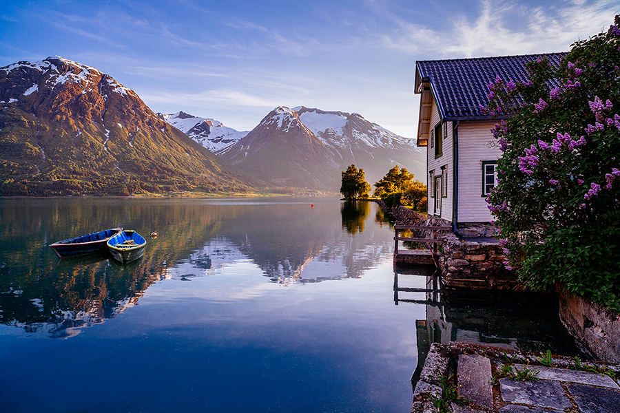 Lakeside building and mountain reflected in water