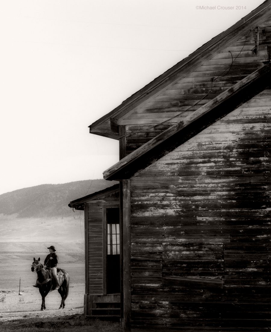 Ranch house with figures beside it