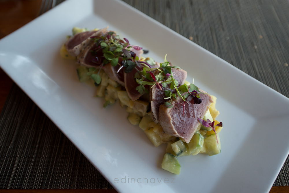 Seared tuna dish straight out of camera with cool, flat restaurant lighting, photo by Edin Chavez