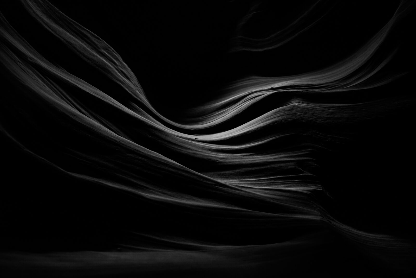 Edin Chavez black and white sandstone curves with a narrow ribbon of light