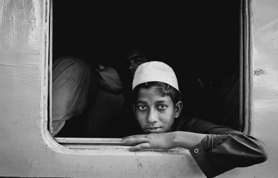 Child looking from a train window