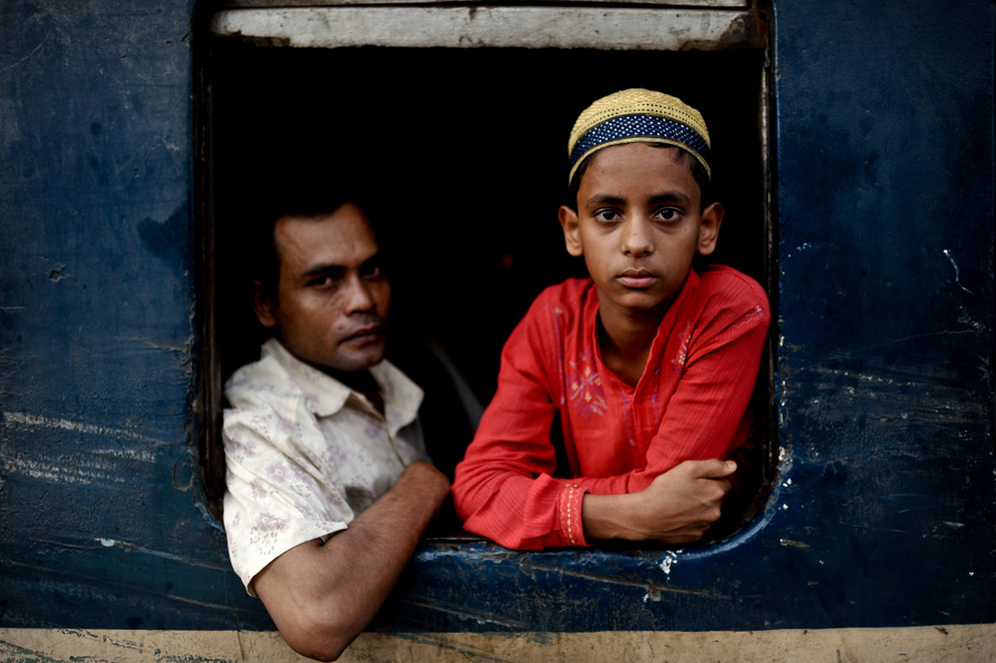 Two passengers looking out a train window