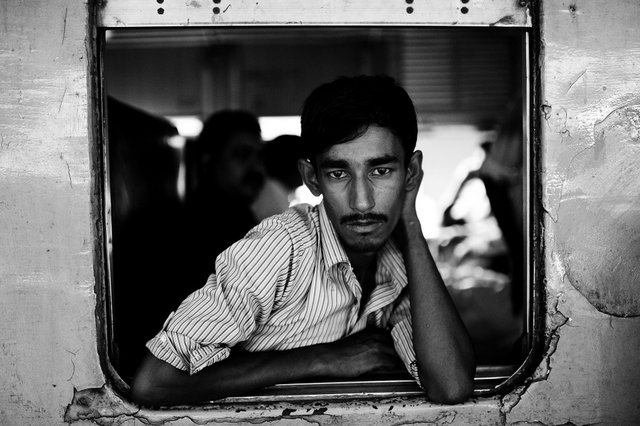 Man leaning out from a train carriage
