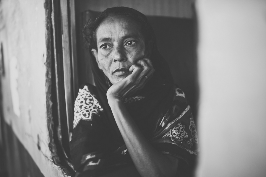 Woman resting her chin in her hand