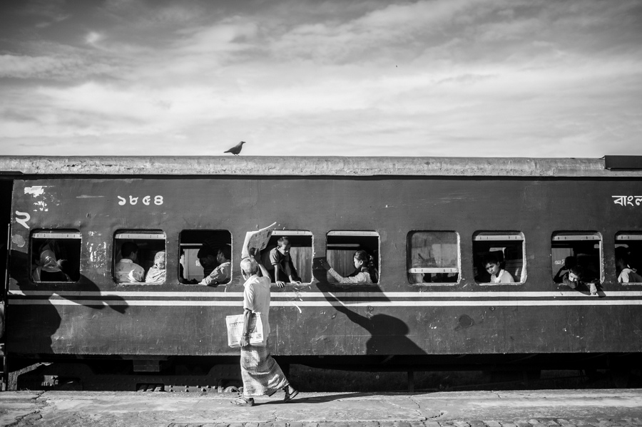 Train and passengers beside a platform
