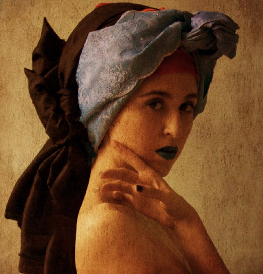 Self-portrait with a grey scarf and warm light