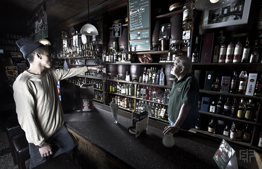 Two figures in a staged shop interior