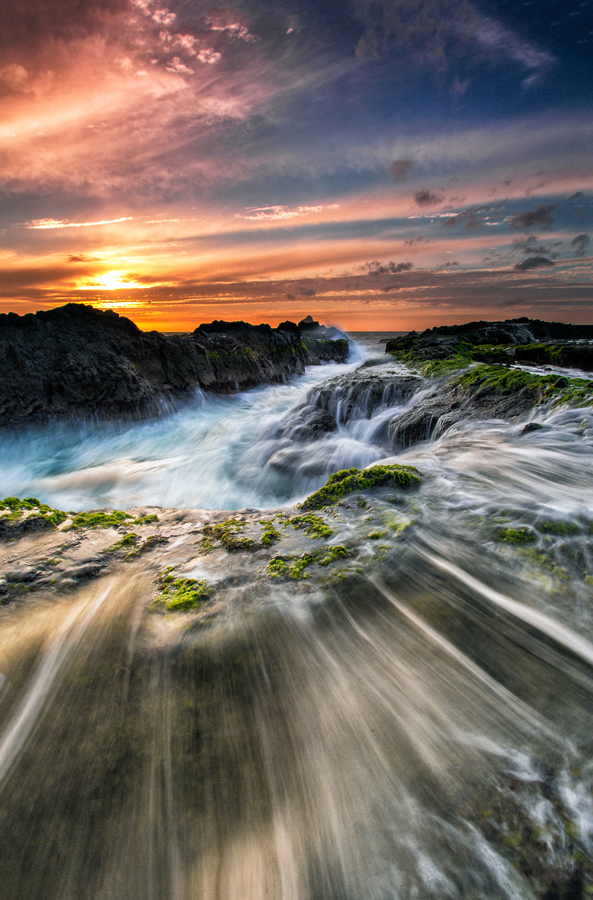 Flowing water across coastal rocks