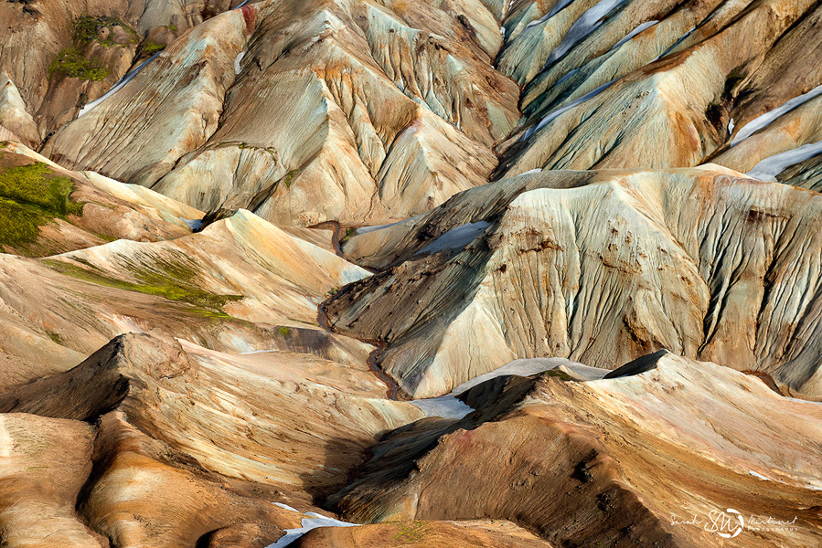 Colorful eroded volcanic ridges from above