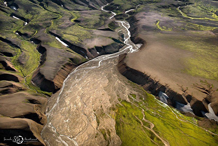 River curves around an eroded plateau