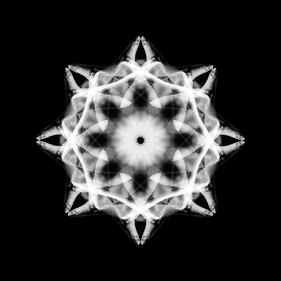 White layered body-mandala pattern on black