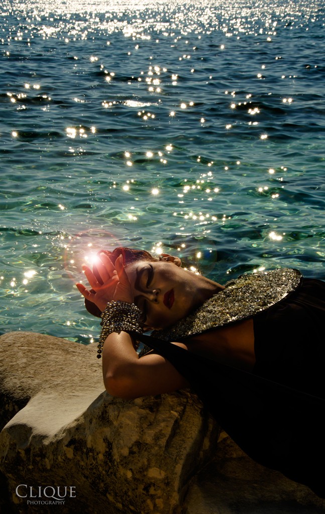 Figure emerging from water in a staged photo