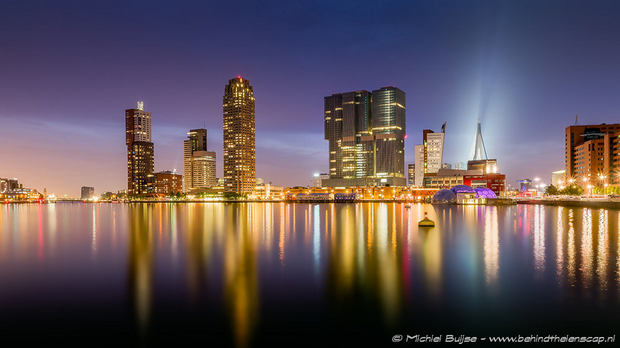 City skyline reflected in a river at night