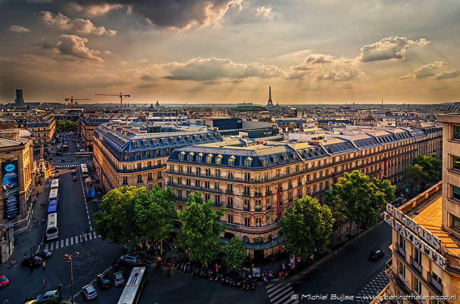 City rooftops and square at golden hour