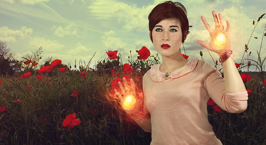 Figure in a red poppy field with glowing light