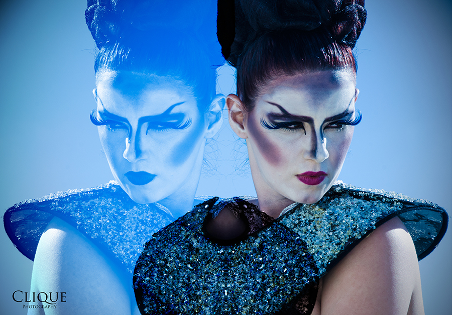 Two women in a stylized blue portrait