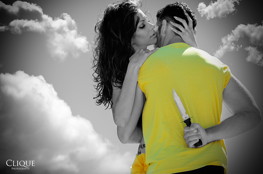 Two figures embracing against a gray sky
