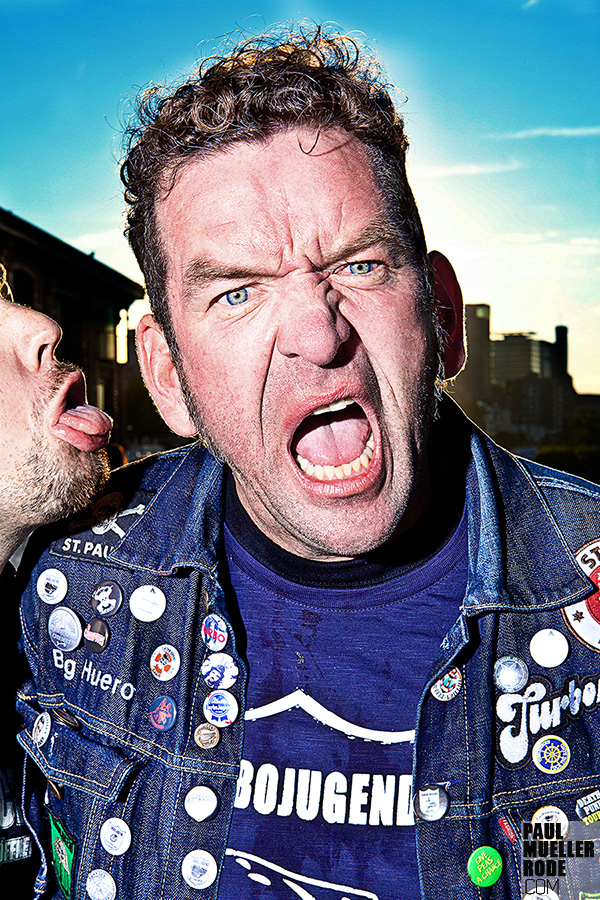 Close portrait of a shouting fan in denim