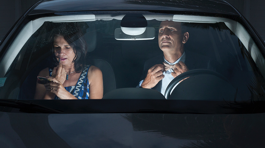 Man and woman talking in a car