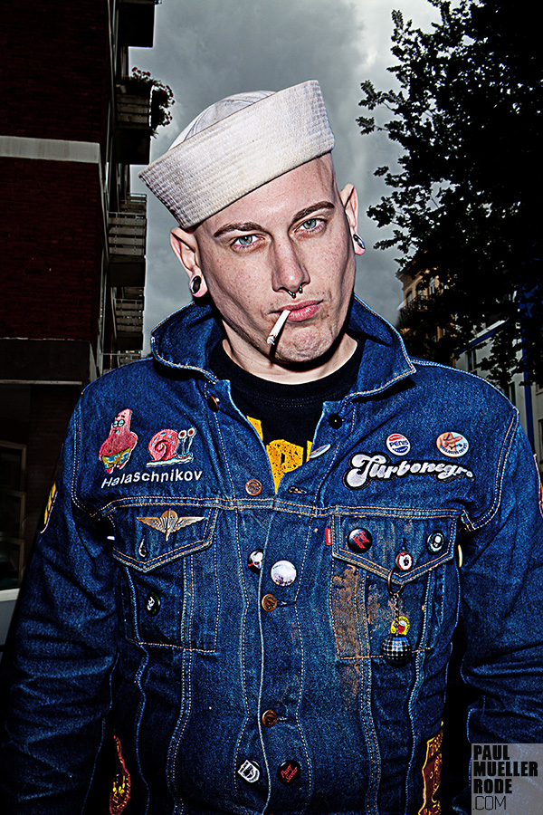Fan in denim jacket and white cap