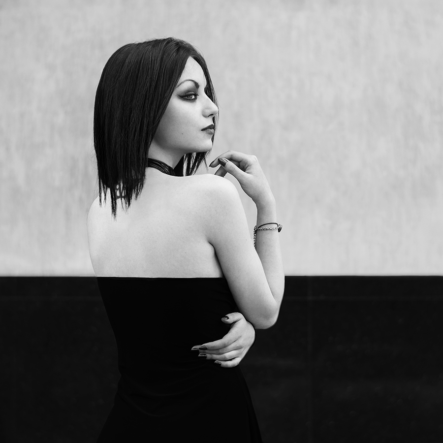 Model with a split light-and-shadow background