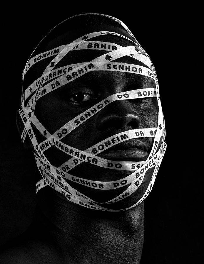 Portrait with patterned fabric wrapped around face
