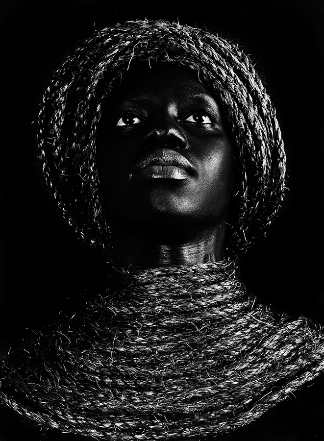 Portrait of a person wearing a textured head wrap