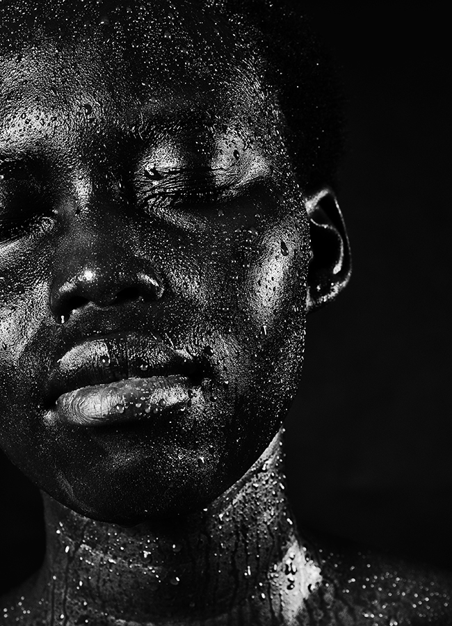 Person with eyes closed in black and white