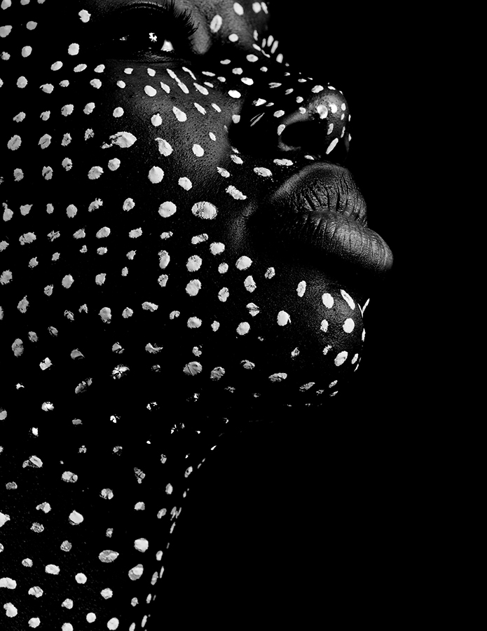 Profile with dots painted on face