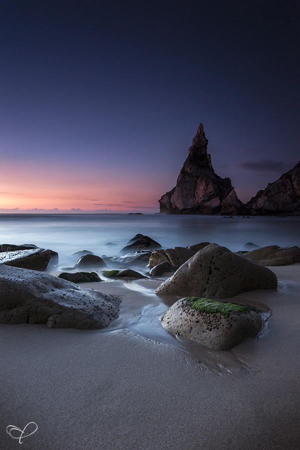 Sea stacks under a pink coastal sky