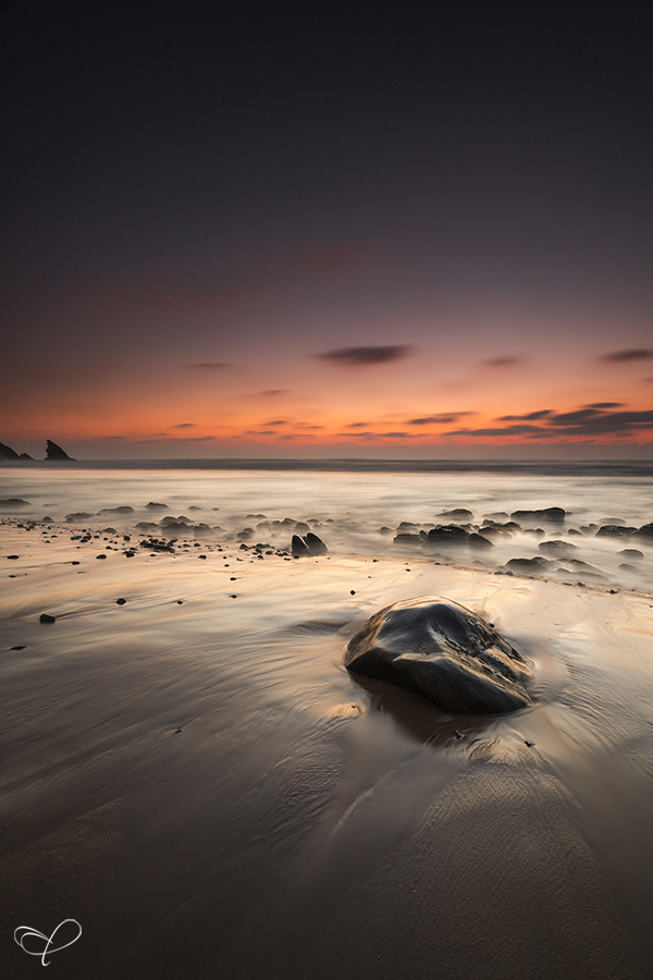 Rocks on a Portuguese beach at sunset