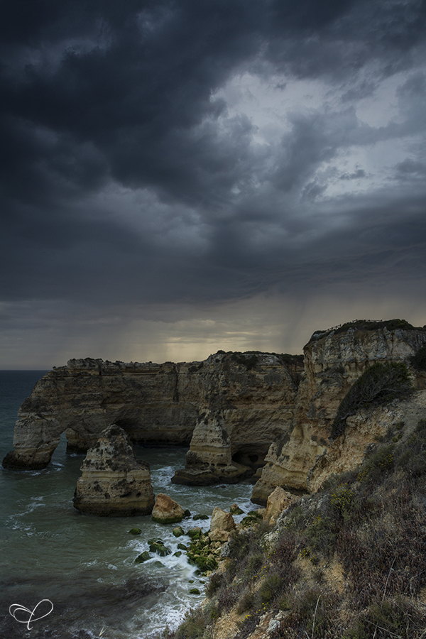 Rugged Atlantic coast beneath stormy clouds