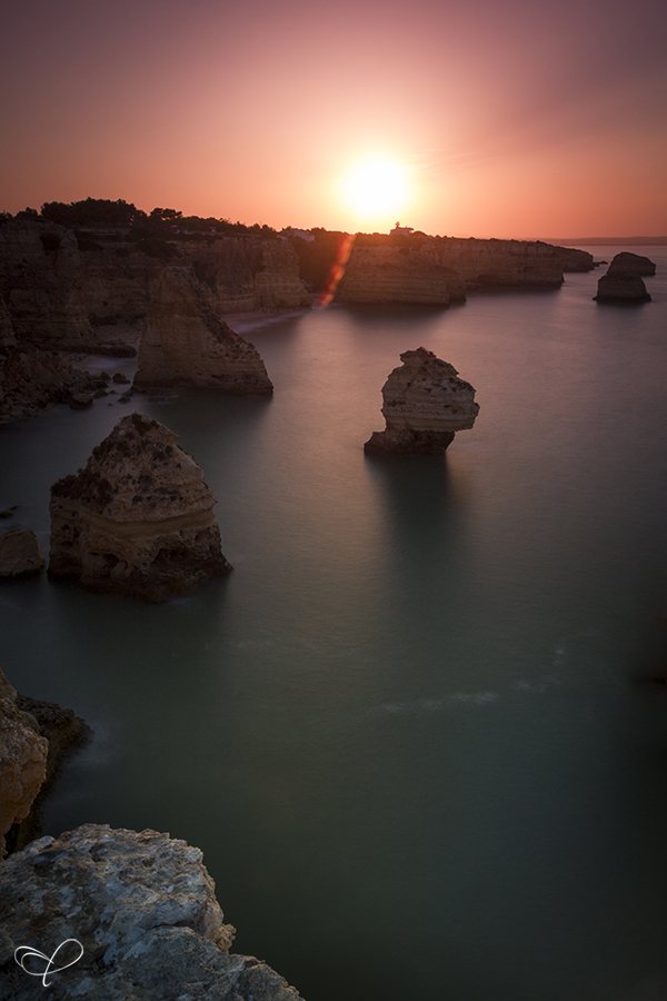 Sunset between sea cliffs on Portugal coast