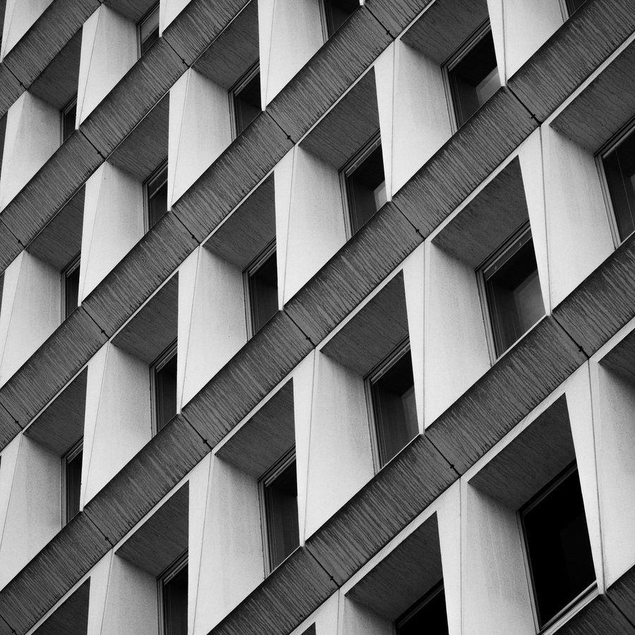 Repeating angled windows on a tall building