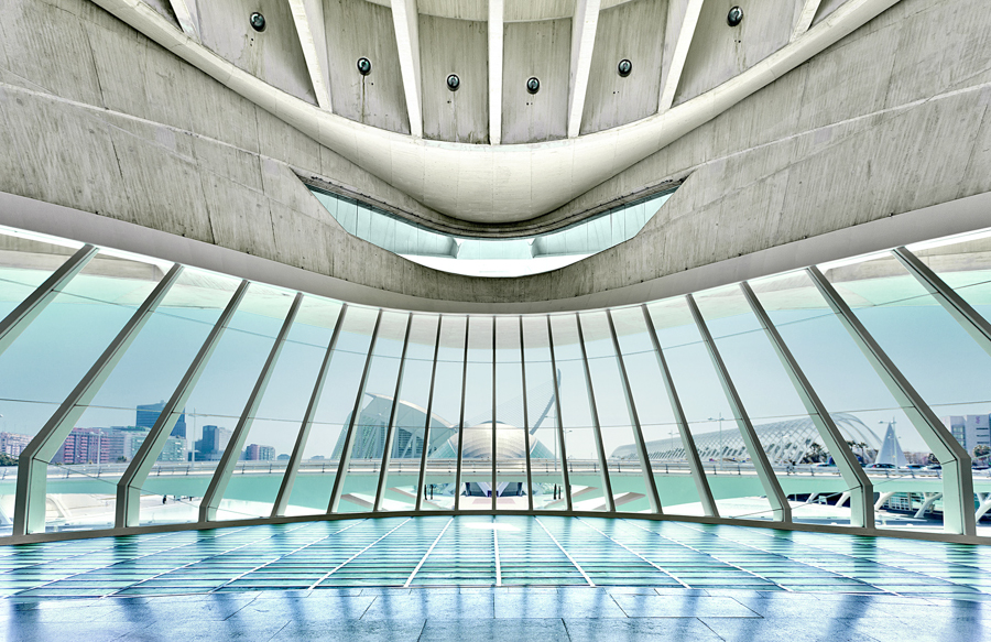 Curved white interior opening toward the water