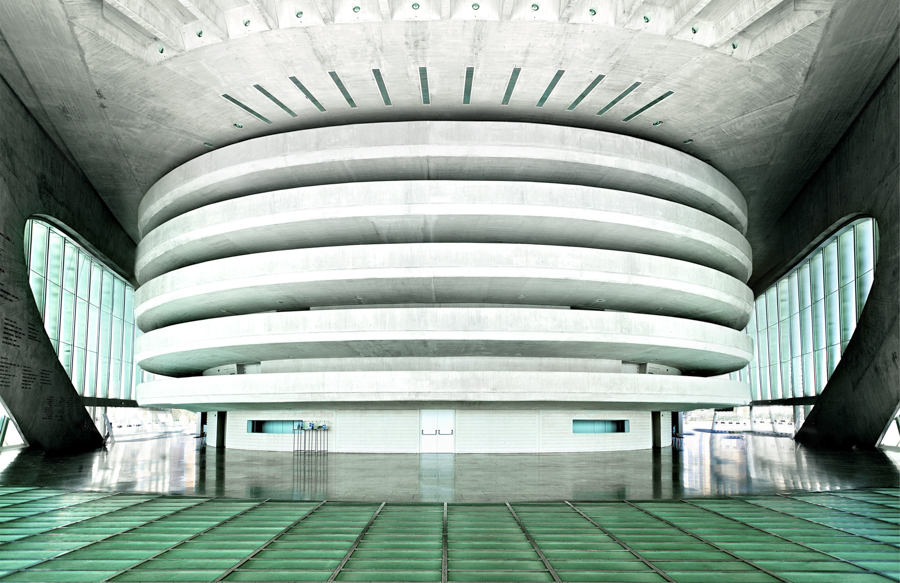 White tiered hall photographed symmetrically