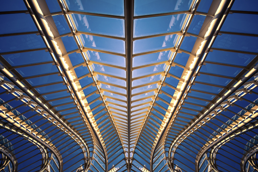 Long arched walkway lit at night