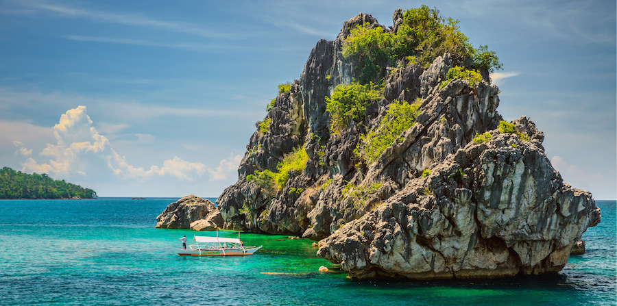 Small boat near a tropical island