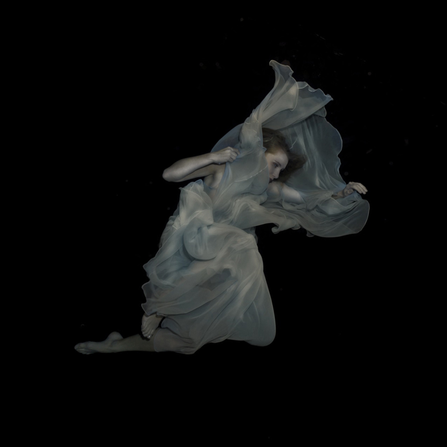 Flowing white fabric forming a ghostly shape