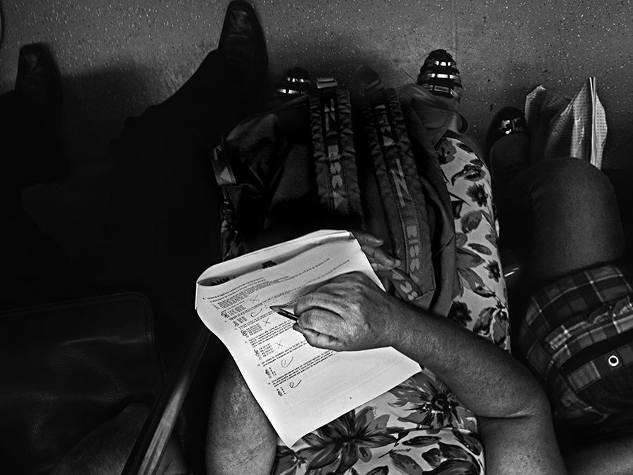 Passenger holding a folded newspaper