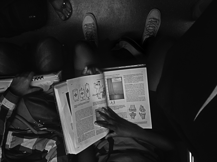 Train passenger looking at an open book