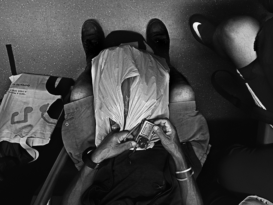 Passenger resting beneath a hat