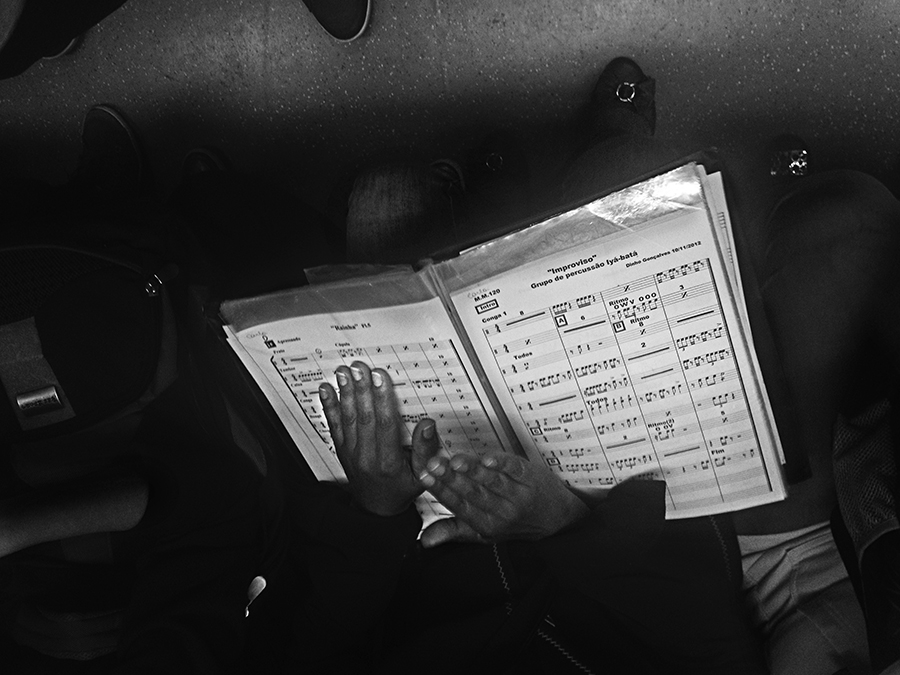 Train passenger reading sheet music