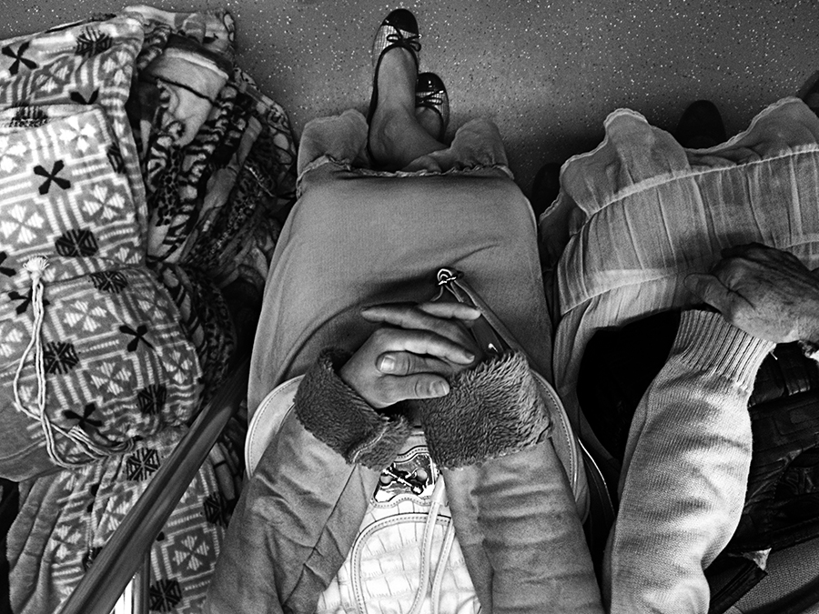 Two passengers beside each other on a train
