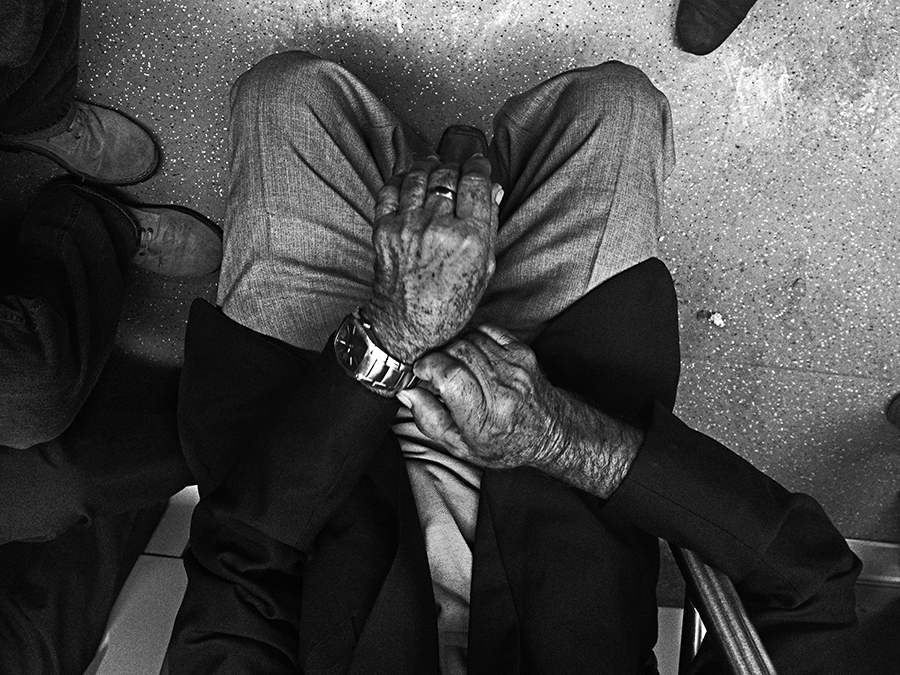 Passenger holding a phone on a train