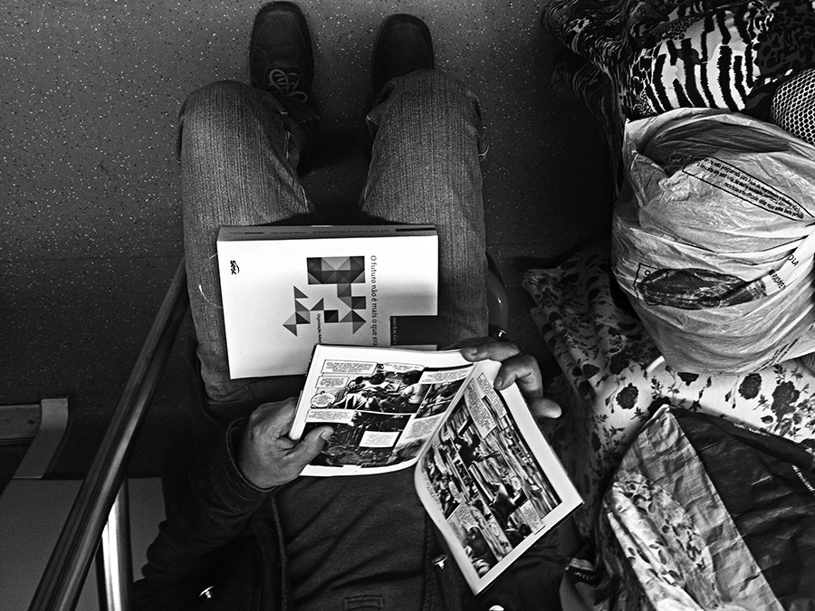 Passenger reading printed materials