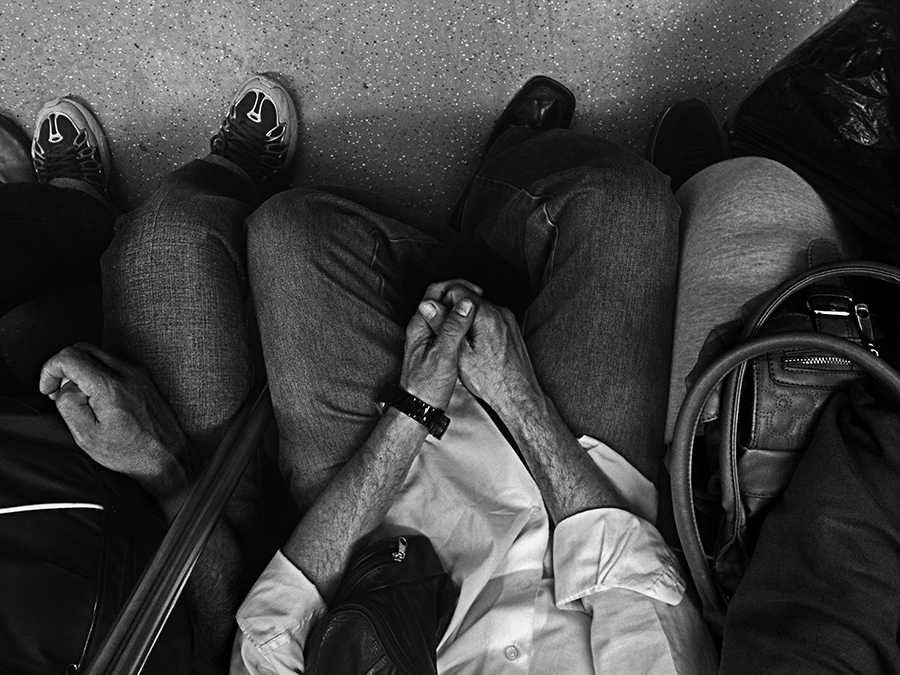 Passengers sitting close together from overhead