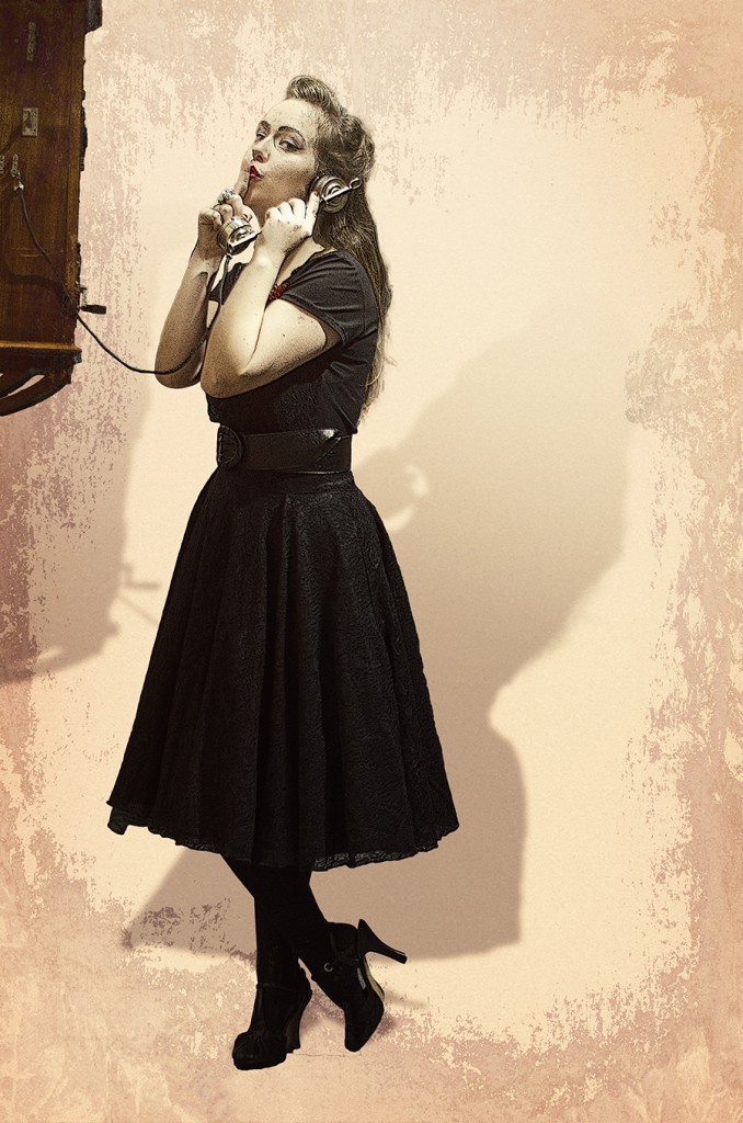 Catherine Rankovic posing in a dark dress