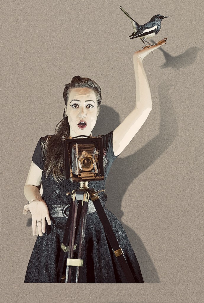 Woman in pin-up styling holding a toy airplane